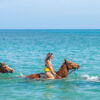 chukka island village outpost horseback ride and swim couple