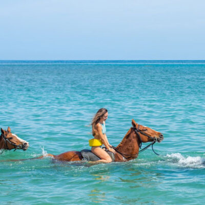 chukka island village outpost horseback ride and swim couple