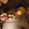 Chukka Monkey Zip and Signature Pass Tourists in Tram Touring Cave