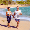 Chukka Ocean Outpost Day Pass Man and Woman Running On Beach