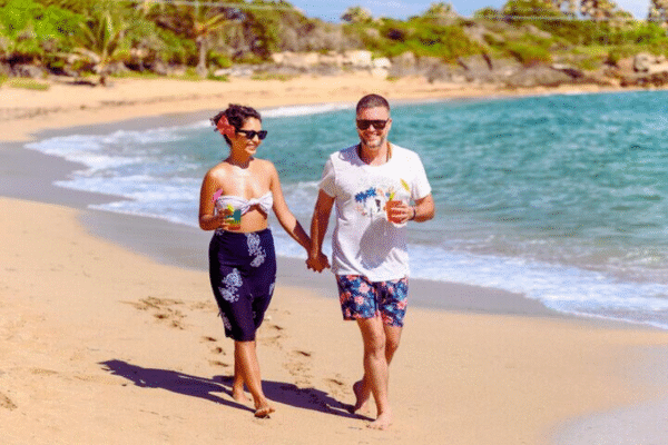 Chukka Ocean Outpost Day Pass Man and Woman Running On Beach