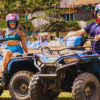 Chukka Ocean Single Man and Woman Smiling on Parked ATVs