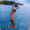 Chukka Private Catamaran Charter Man Jumping in Water