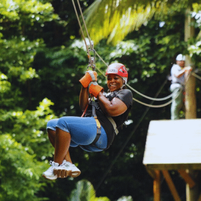 Chukka Zipline and Challenge Course Woman Having Fun on Zipline