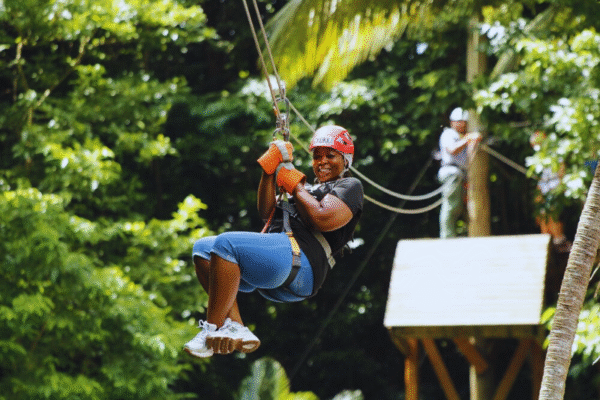 Chukka Zipline and Challenge Course Woman Having Fun on Zipline