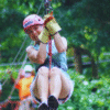 Chukka Zipline and Challenge Course Woman Smiling on Zipline