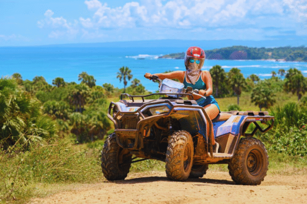 Chukka Ocean Double: ATV or Dune Buggy and Ocean Zipline Adventure Lady on ATVs